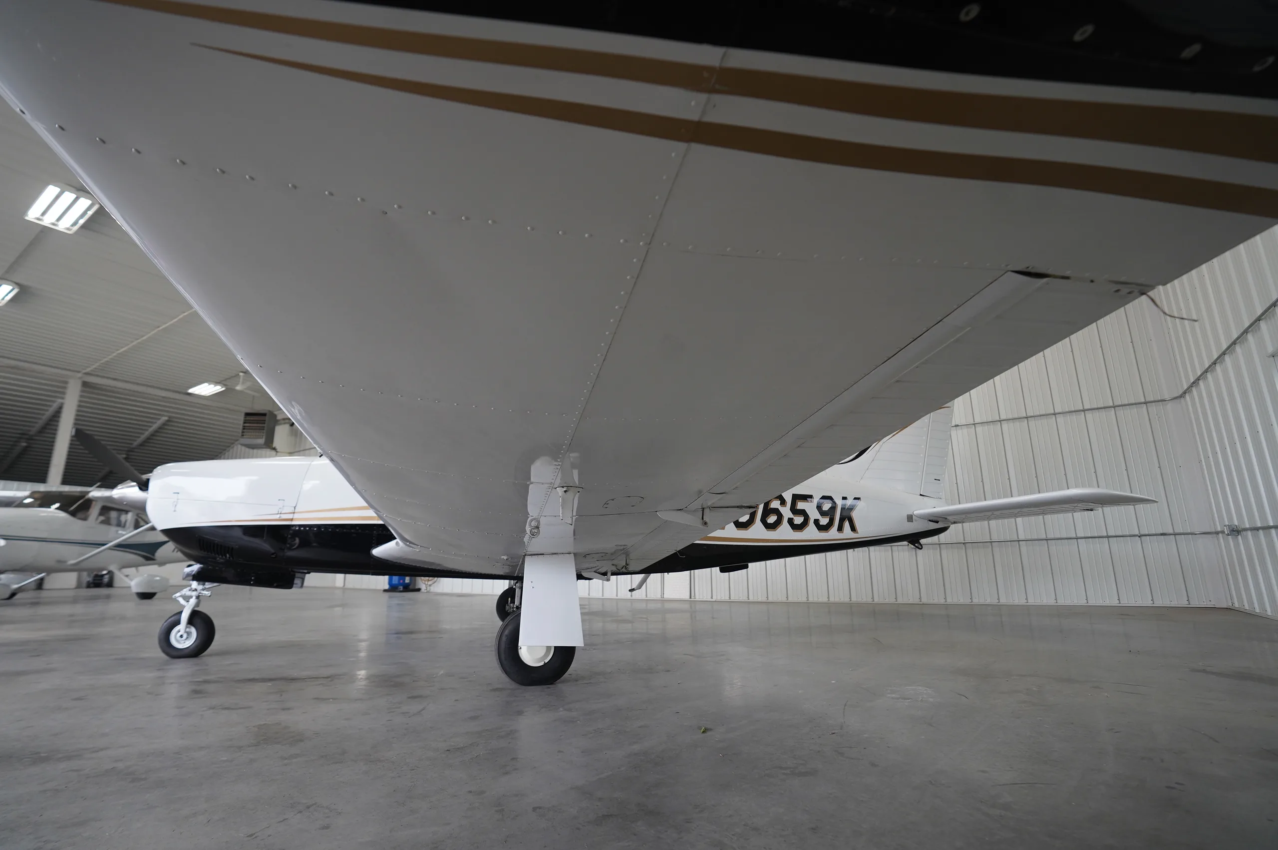 Exterior view of a 1976 Piper Arrow II, N9659K.