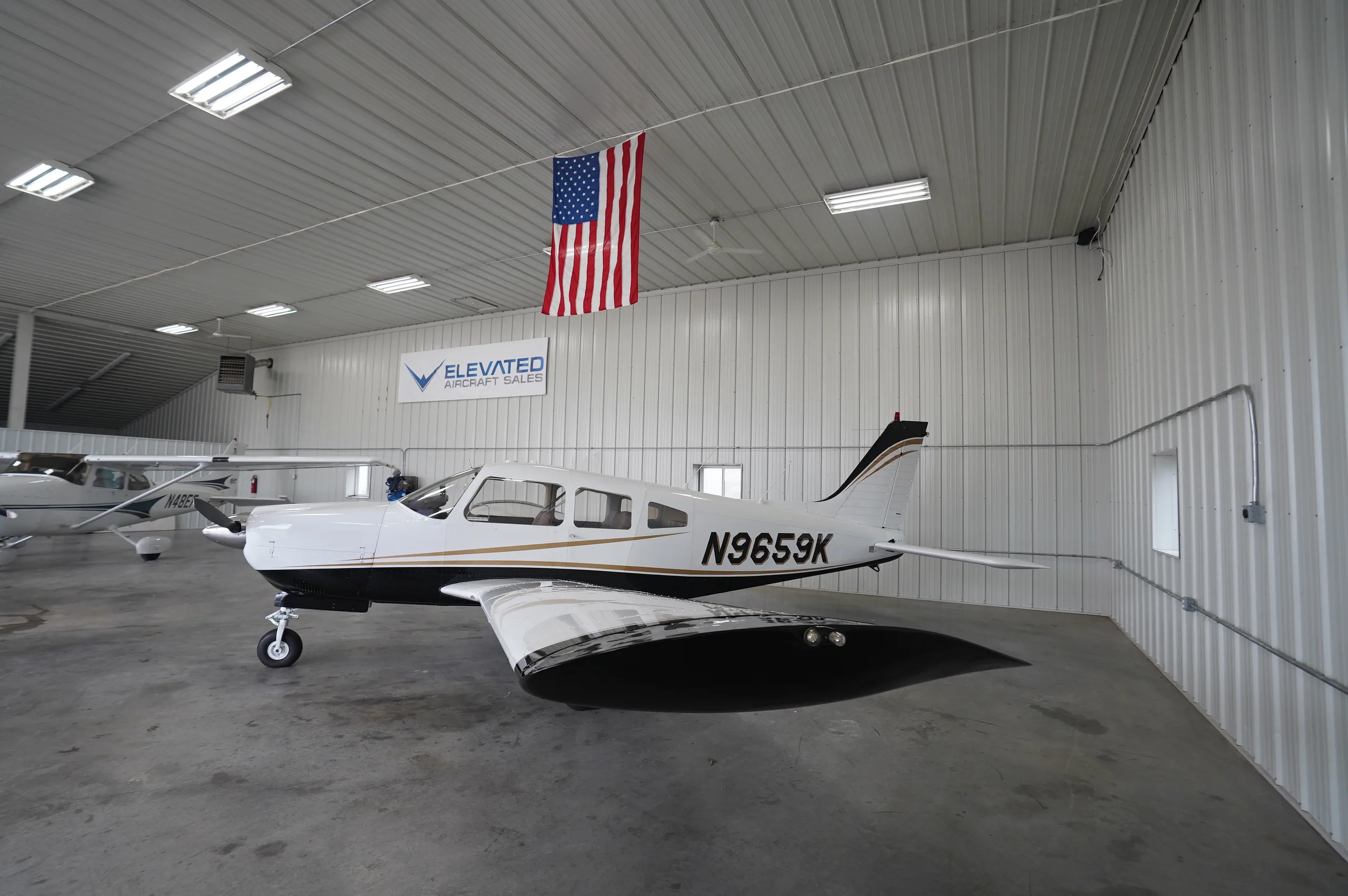 Exterior view of a 1976 Piper Arrow II, N9659K.