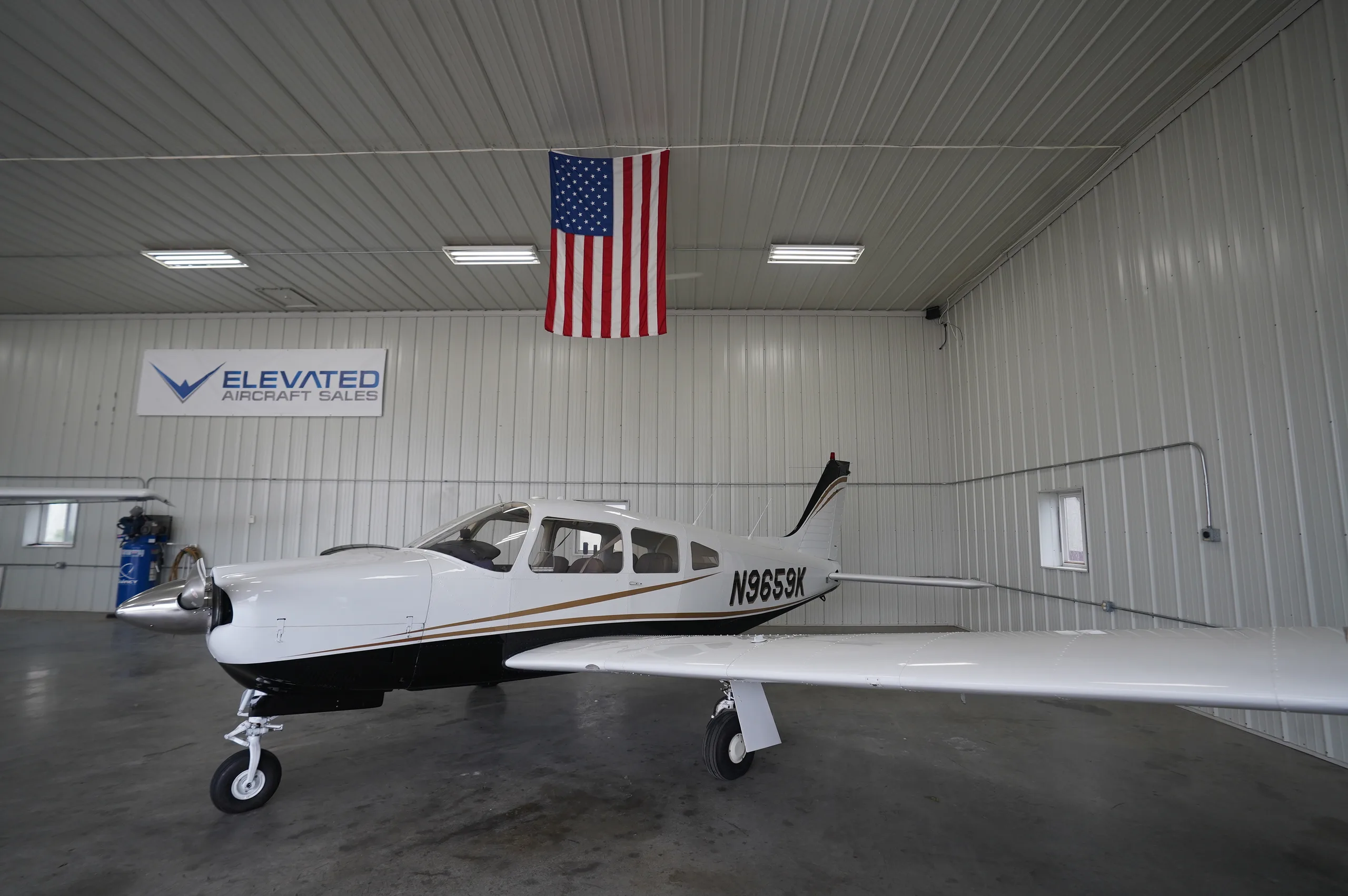 Exterior view of a 1976 Piper Arrow II, N9659K.