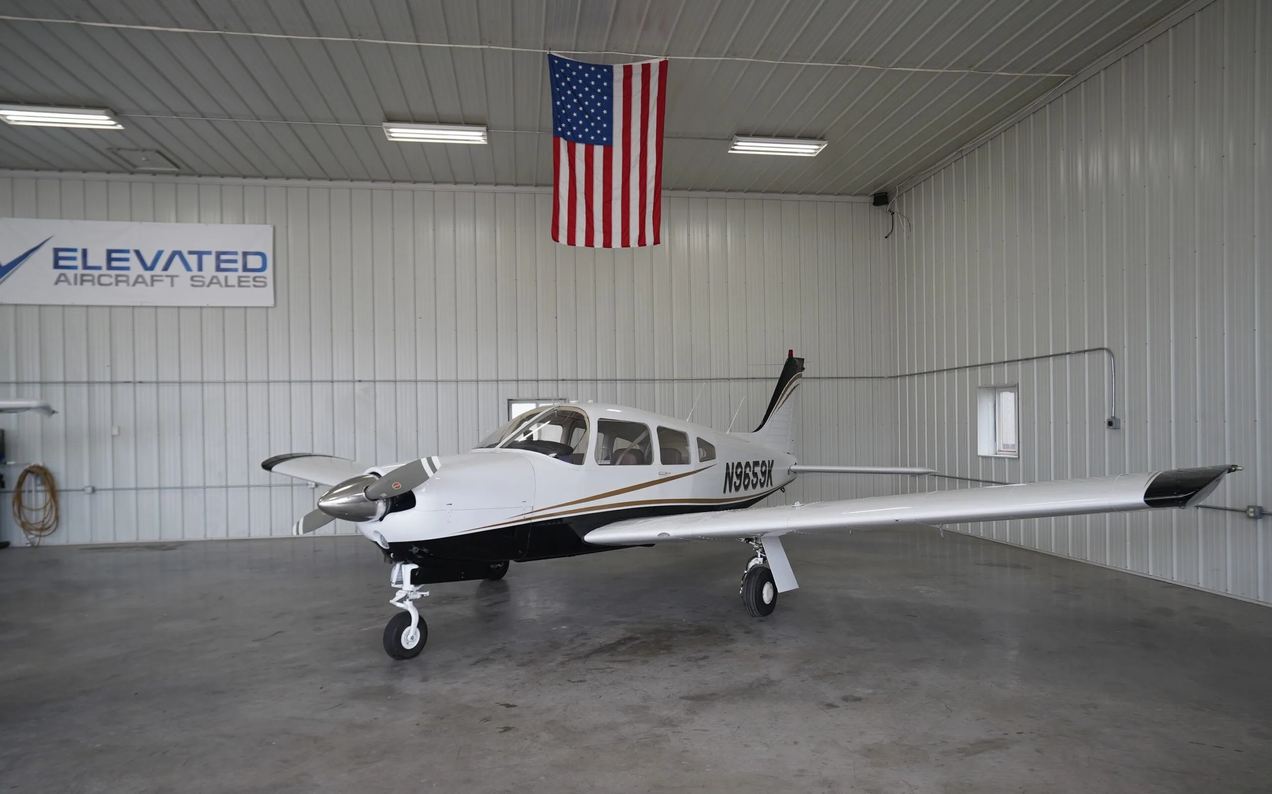 Exterior view of a 1976 Piper Arrow II, N9659K.