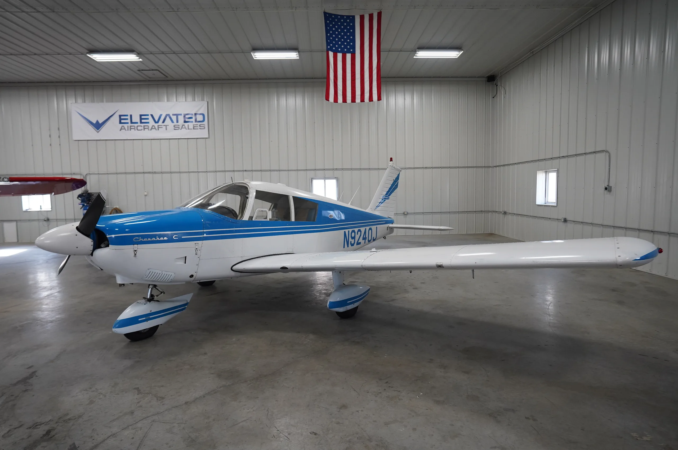Exterior view of a 1966 Piper Cherokee 180, N9240J.