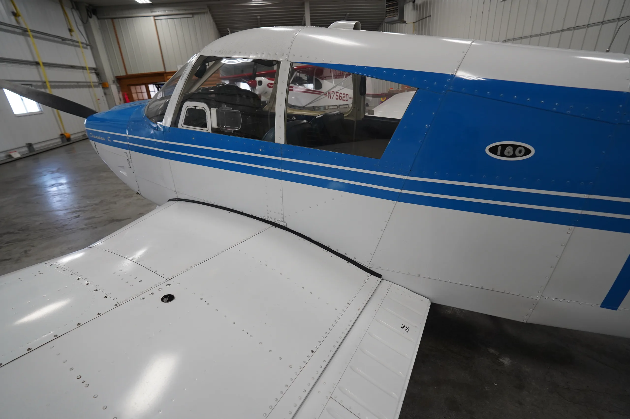 Exterior view of a 1966 Piper Cherokee 180, N9240J.