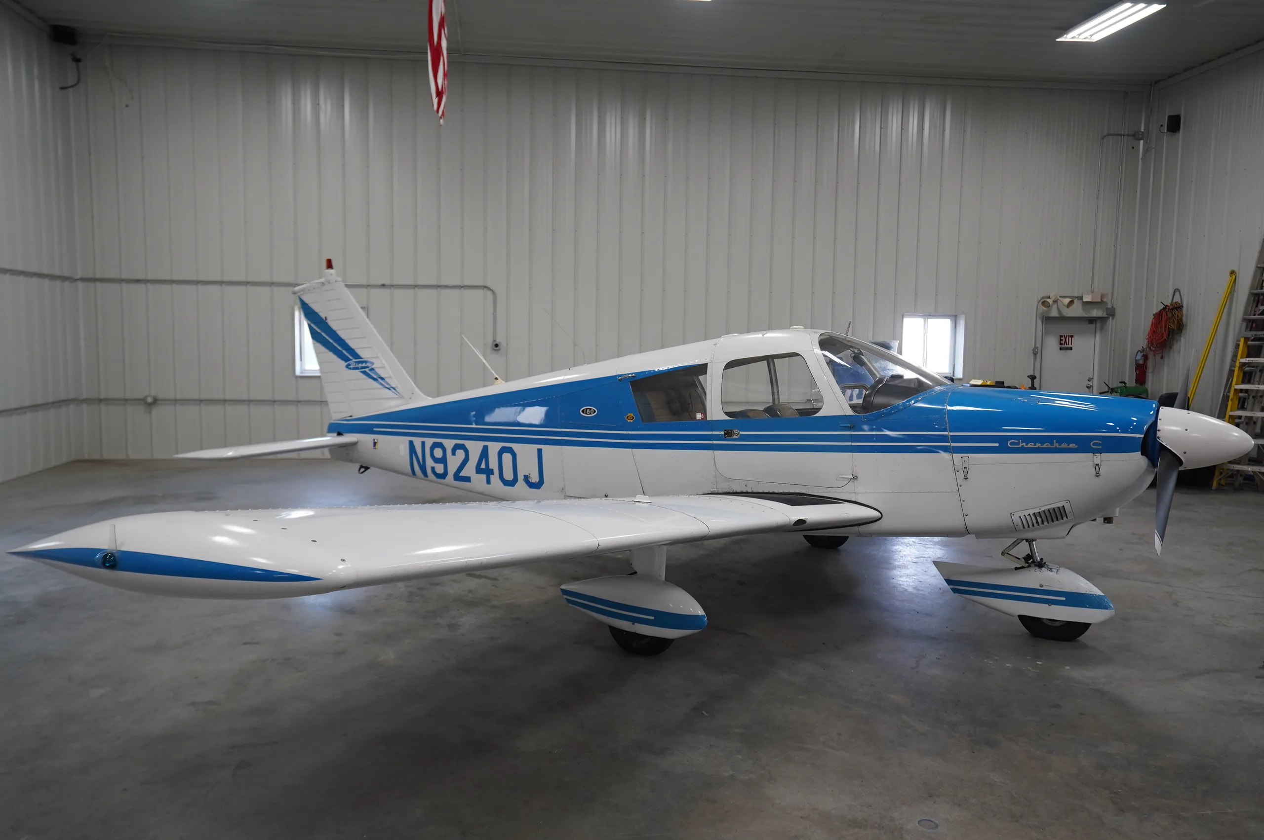 Exterior view of a 1966 Piper Cherokee 180, N9240J.