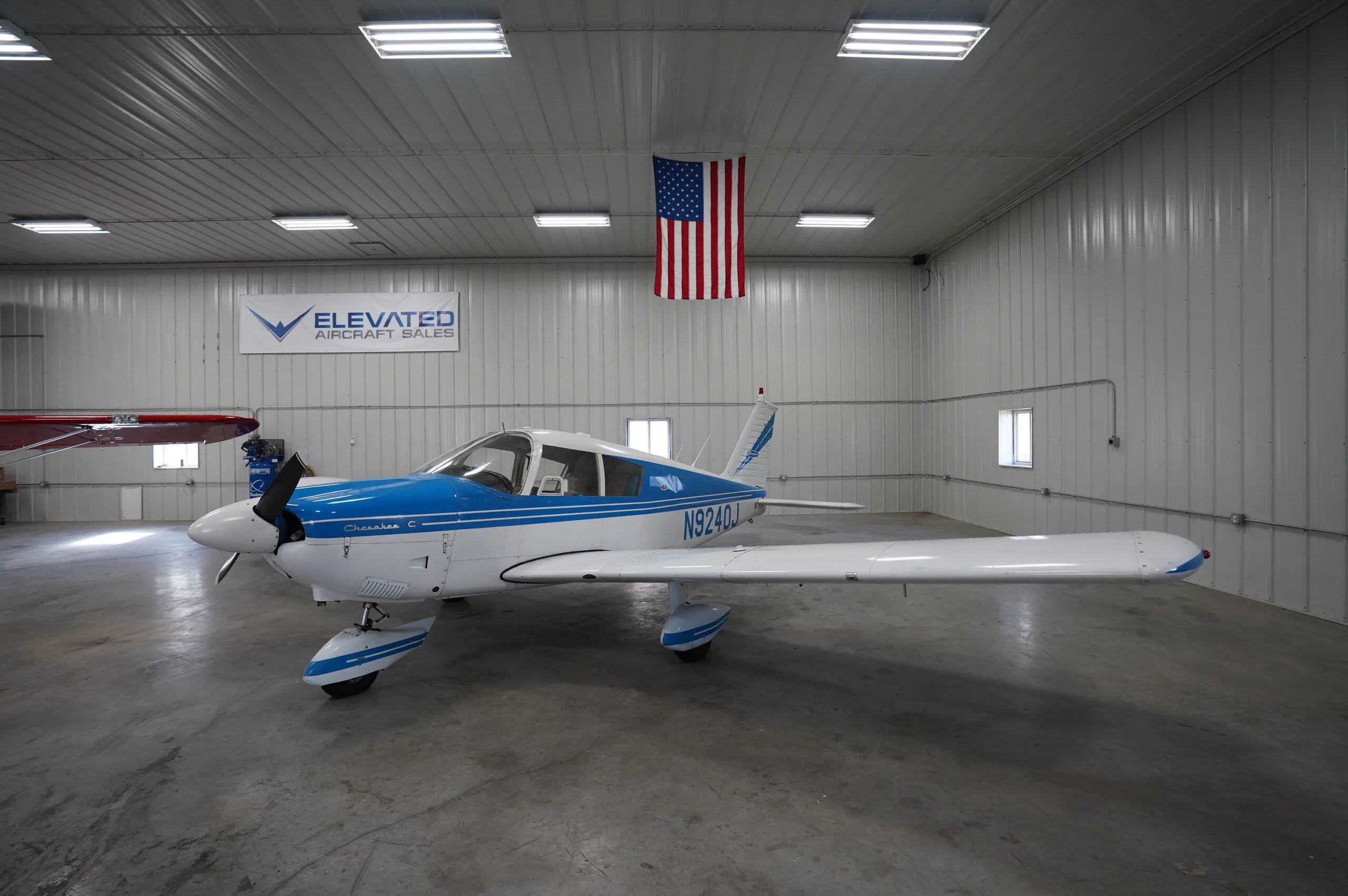 Exterior view of a 1966 Piper Cherokee 180, N9240J.