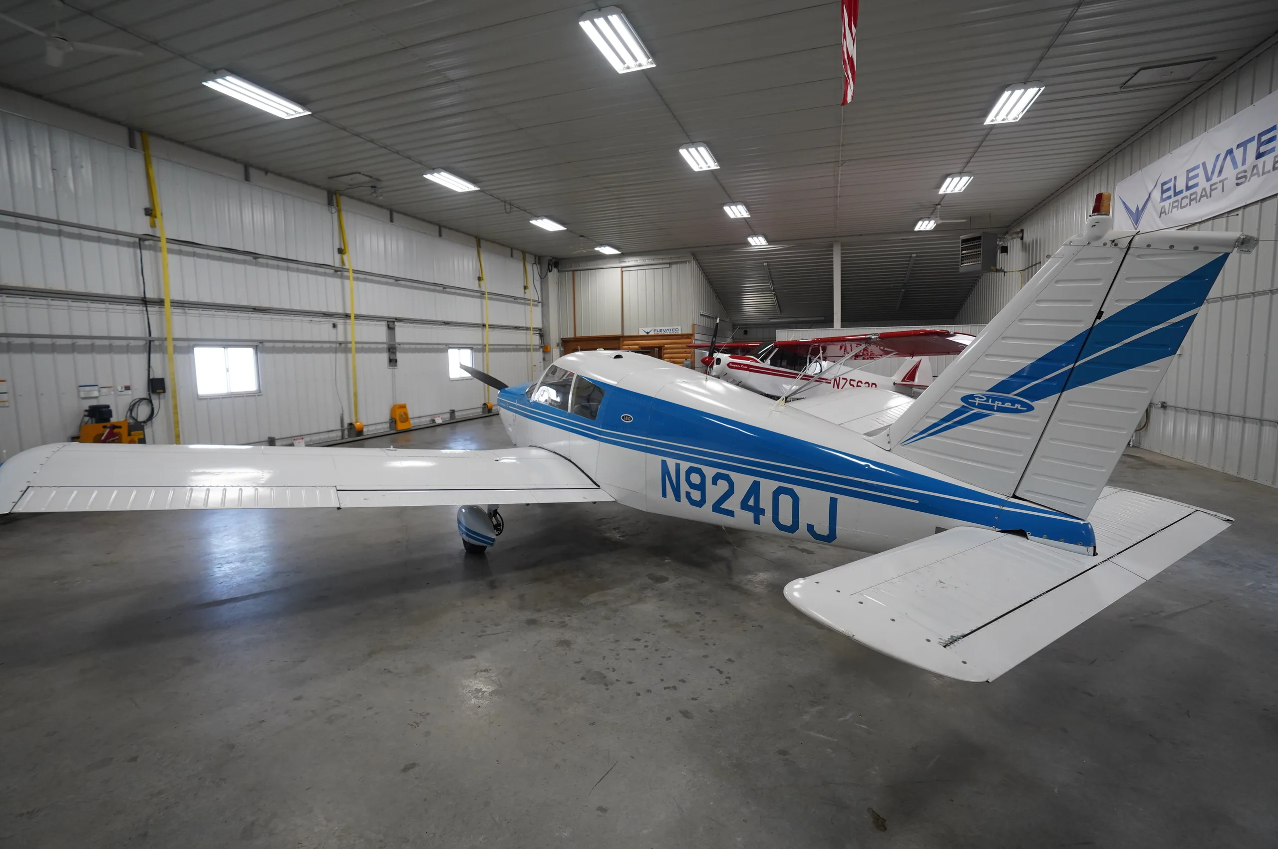 Exterior view of a 1966 Piper Cherokee 180, N9240J.