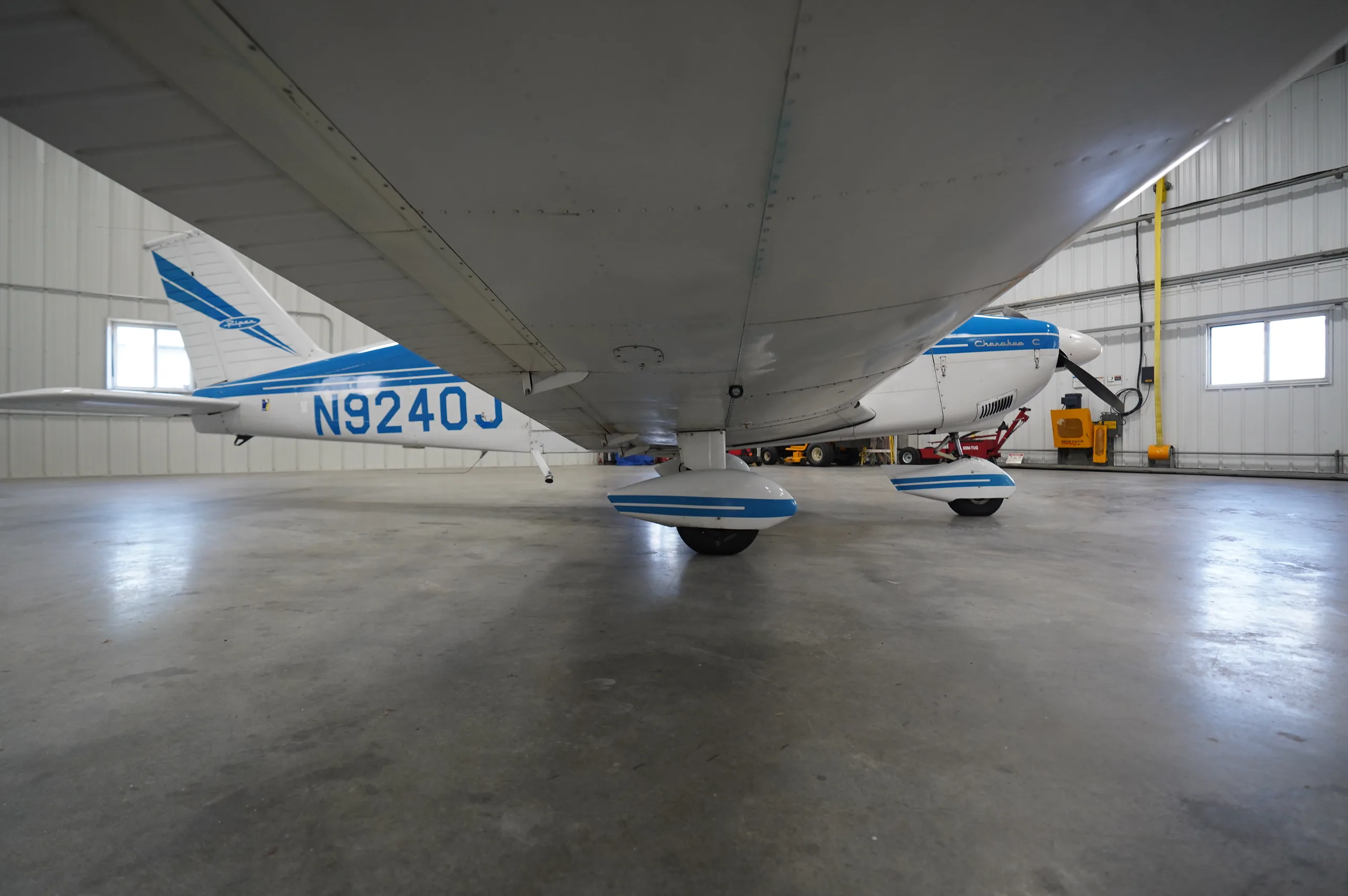 Exterior view of a 1966 Piper Cherokee 180, N9240J.