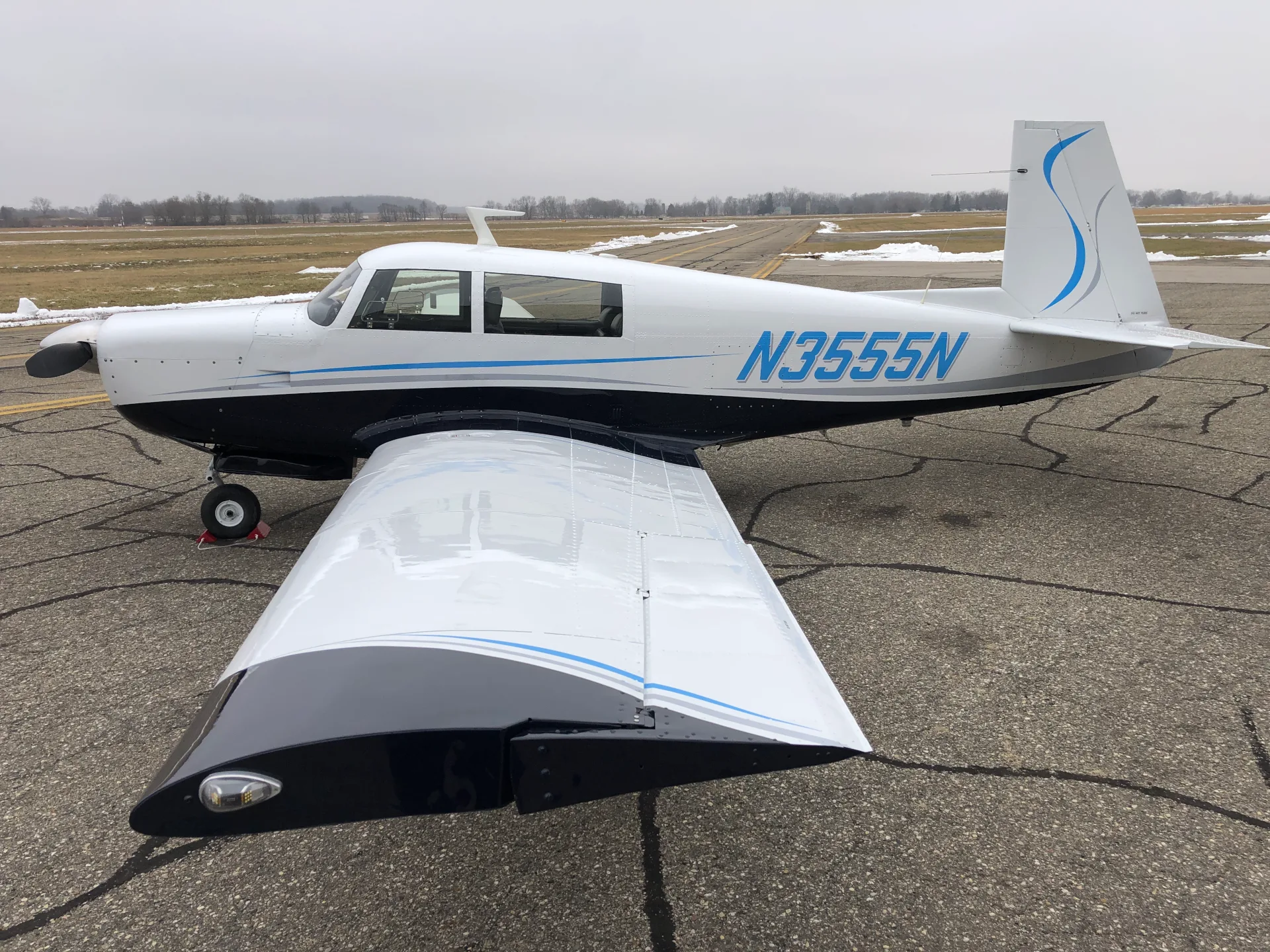Exterior view of a 1967 Mooney M20F - Elite Air Service.