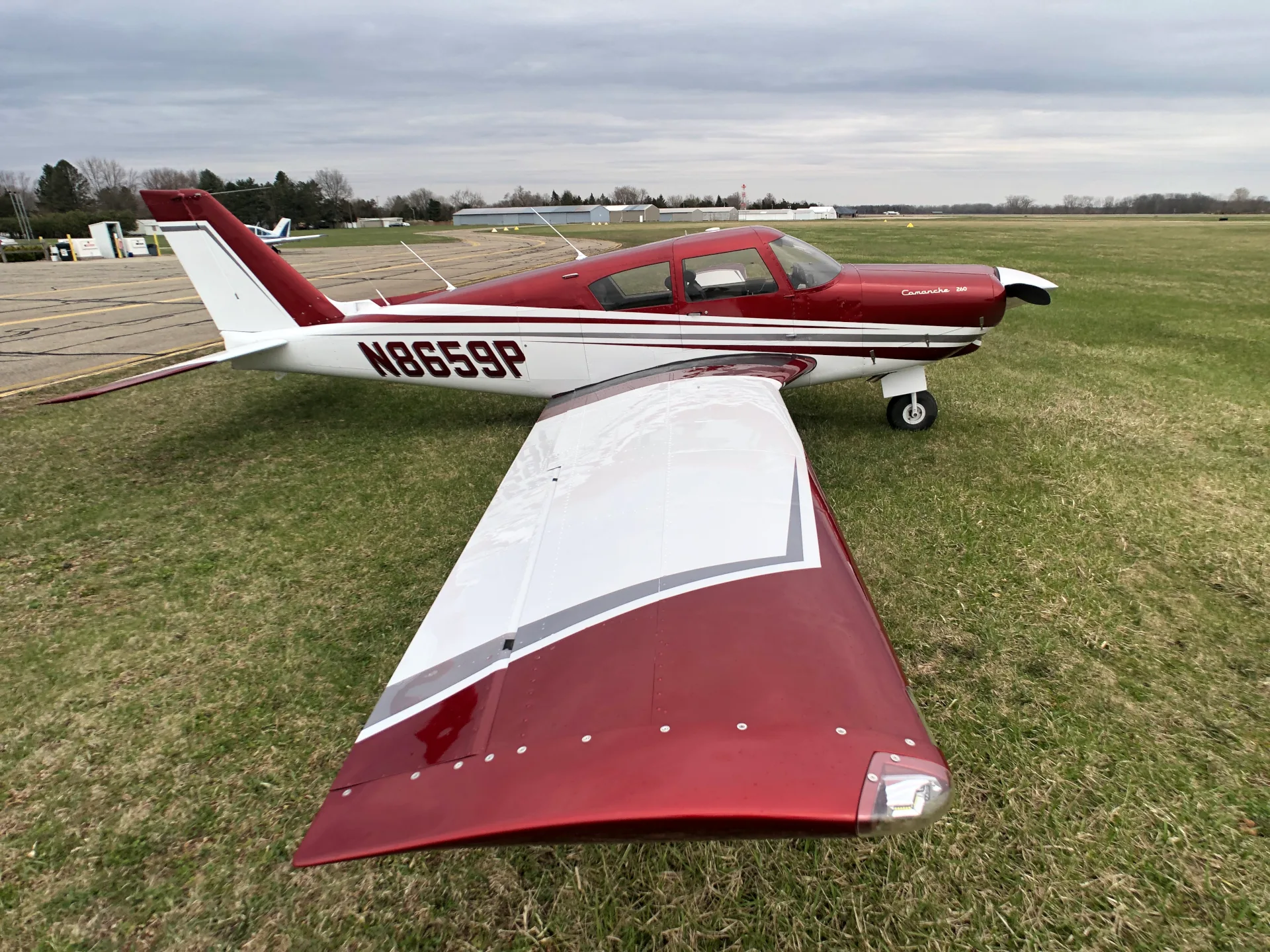 Exterior view of a 1964 Piper Comanche 260 New Scheme - Elite Air Service.