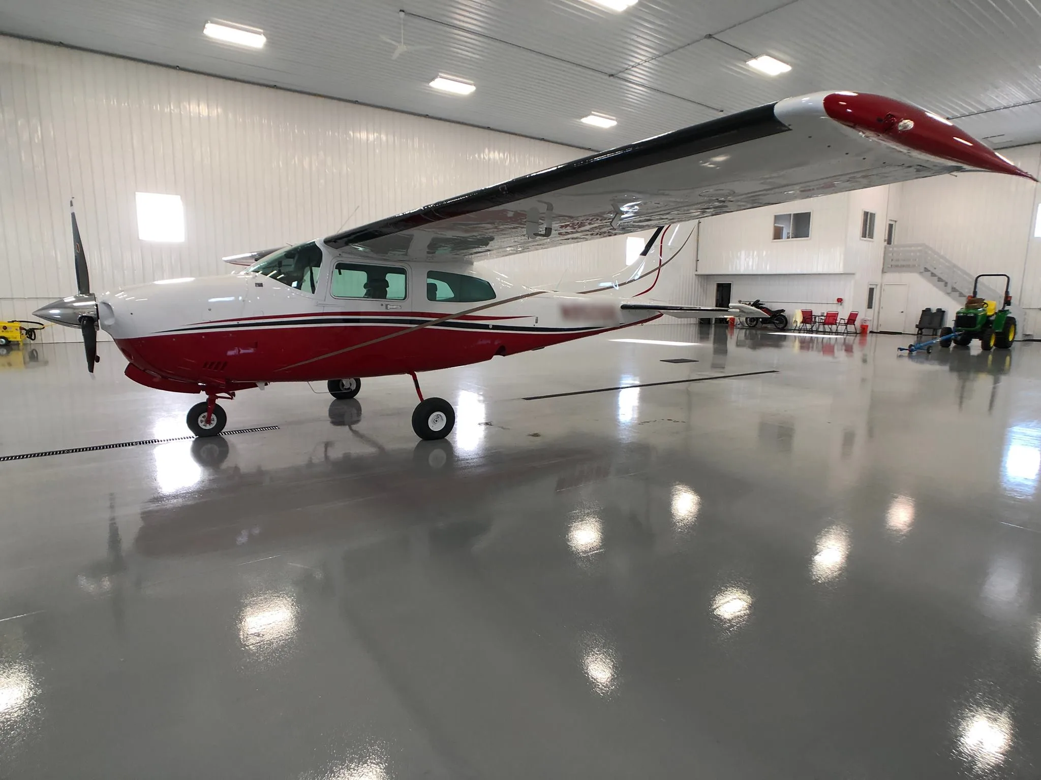 Exterior view of a 1979 Cessna T210N New Scheme - Elite Air Service.