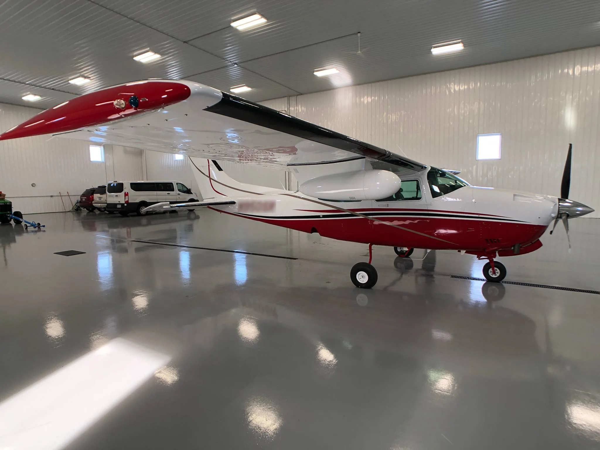 Exterior view of a 1979 Cessna T210N New Scheme - Elite Air Service.