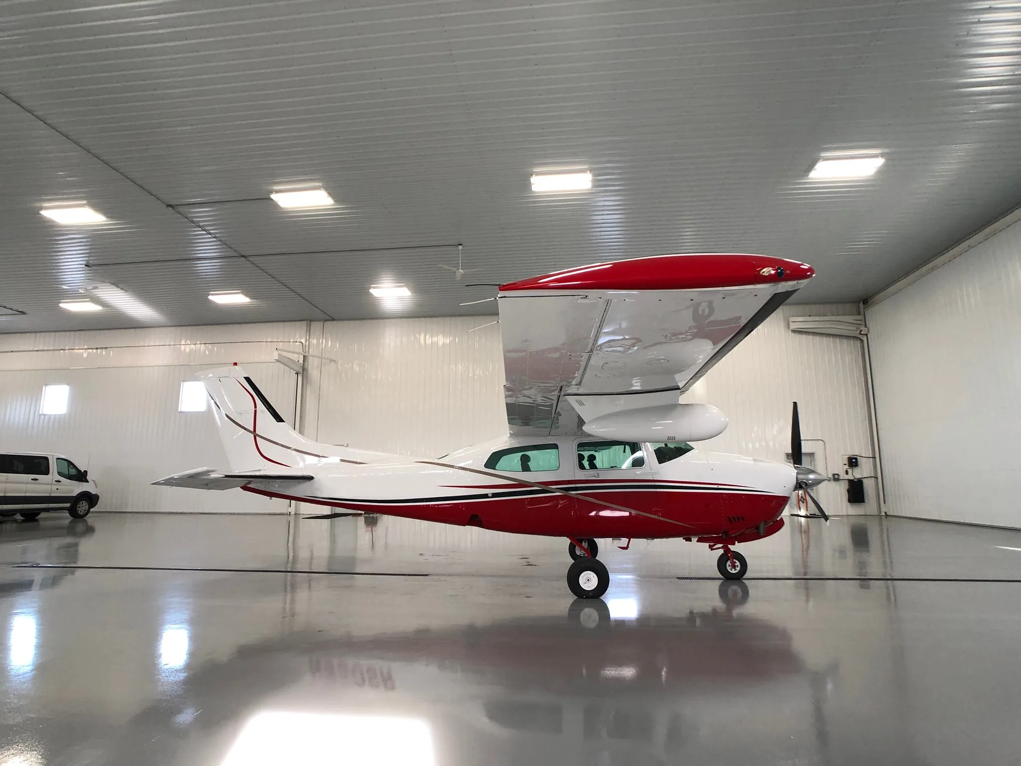 Exterior view of a 1979 Cessna T210N New Scheme - Elite Air Service.