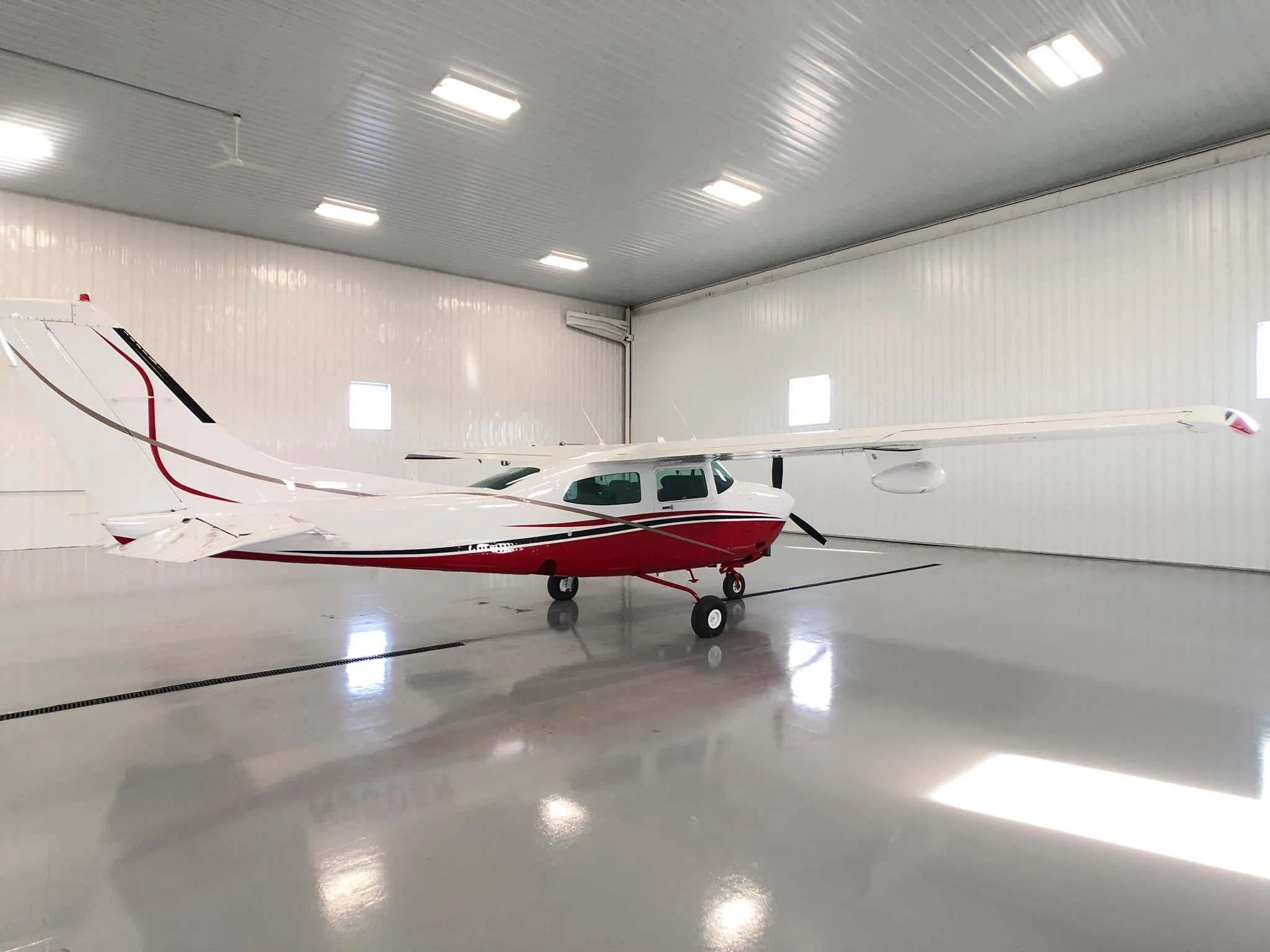 Exterior view of a 1979 Cessna T210N New Scheme - Elite Air Service.