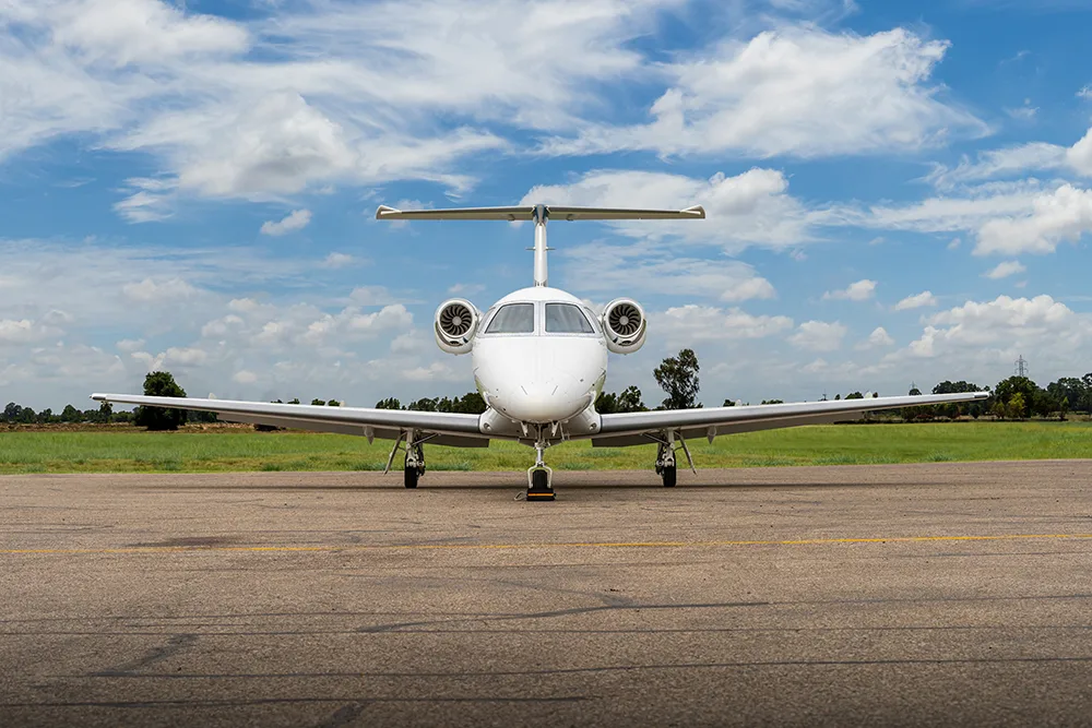 Exterior view of a 2012 Embraer Phenom 100, N611EC.