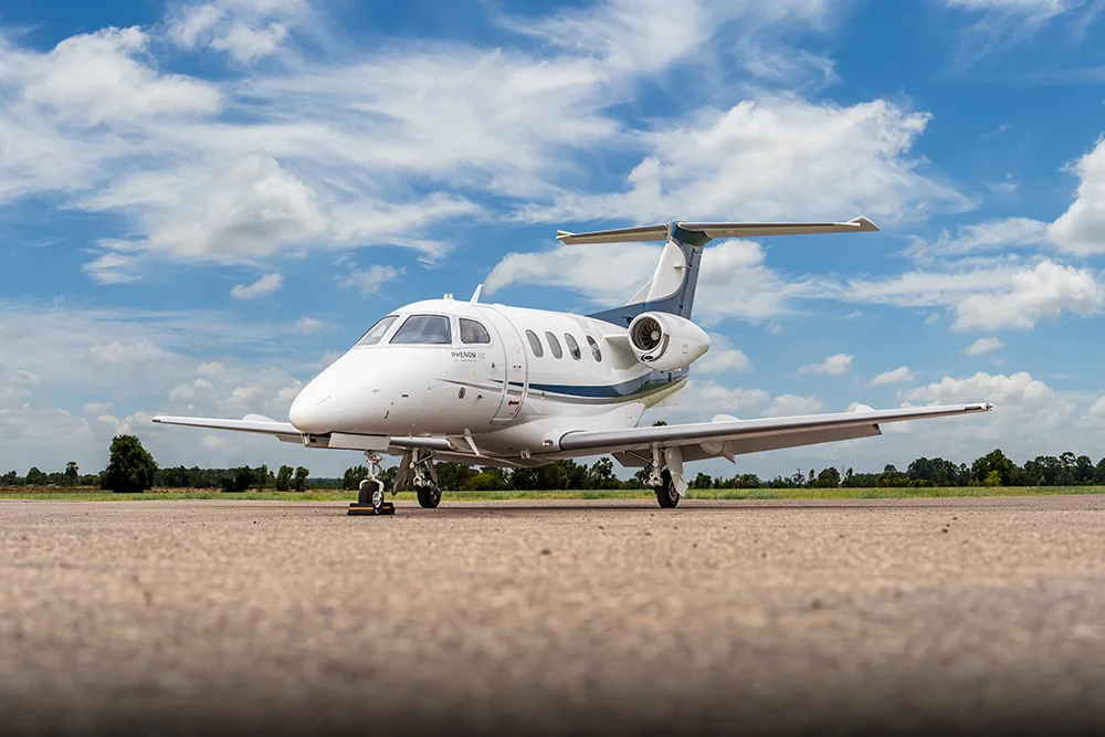 Exterior view of a 2012 Embraer Phenom 100, N611EC.