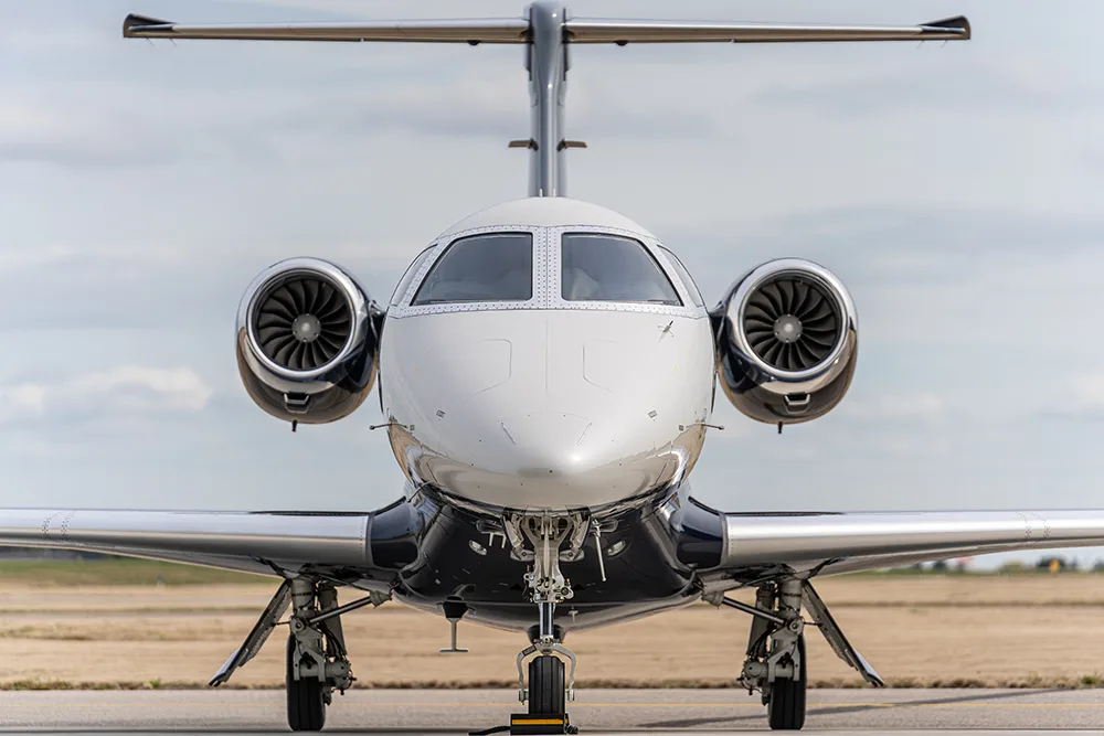 Exterior view of a 2024 Embraer Phenom 300E, N24PL.