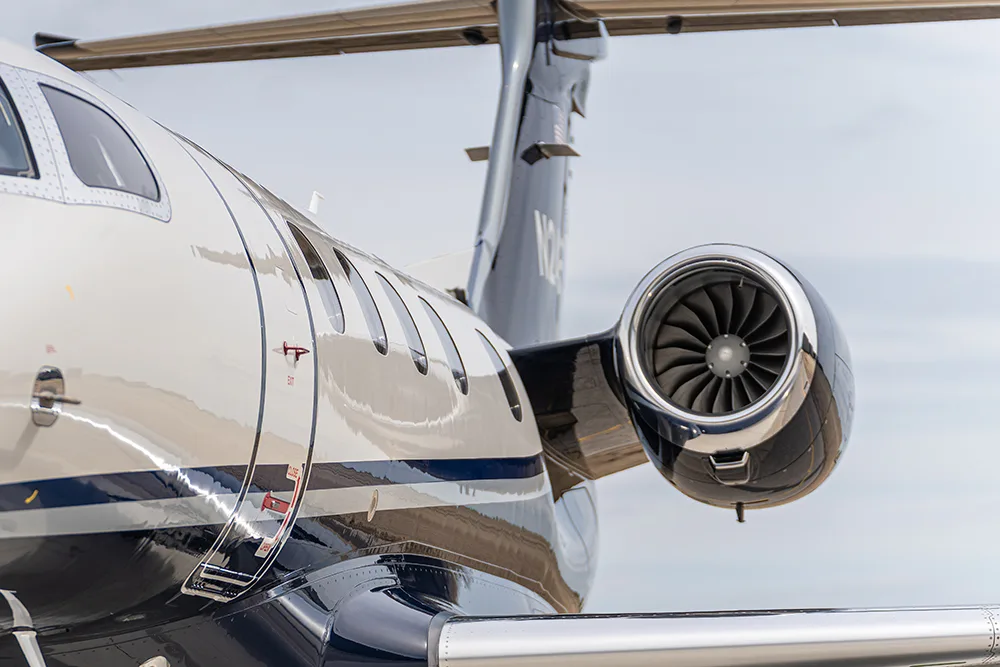 Exterior view of a 2024 Embraer Phenom 300E, N24PL.
