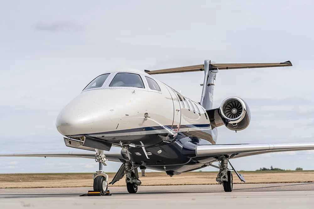 Exterior view of a 2024 Embraer Phenom 300E, N24PL.