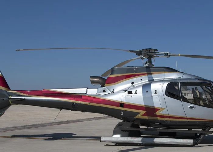 Exterior view of a 2002 Robinson R22 Beta II, I-RUIS.