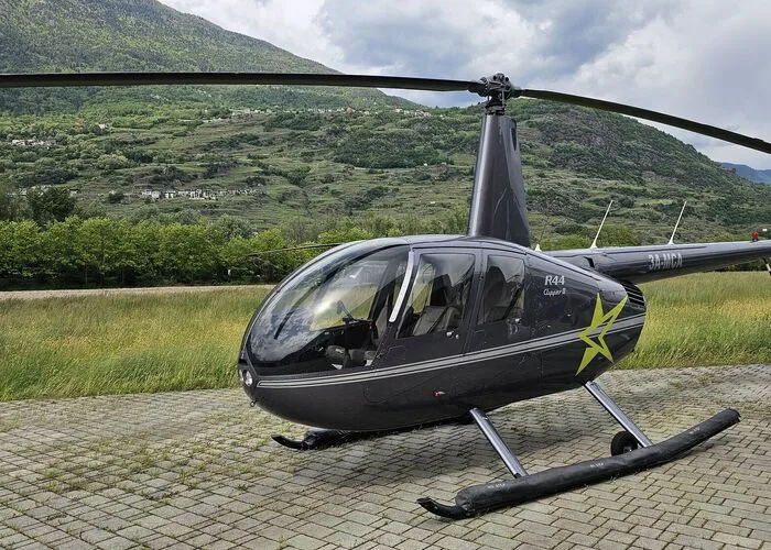 Exterior view of a 2003 Robinson R44 Clipper II, OM-HAB.