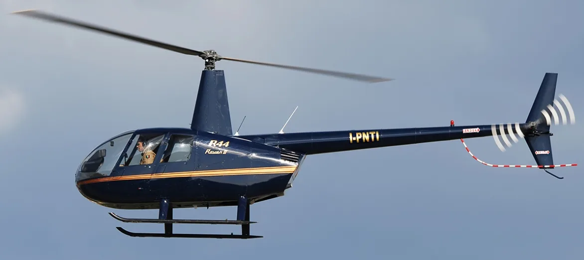 Exterior view of a 2004 Robinson R44 Raven II, I-PNTI.