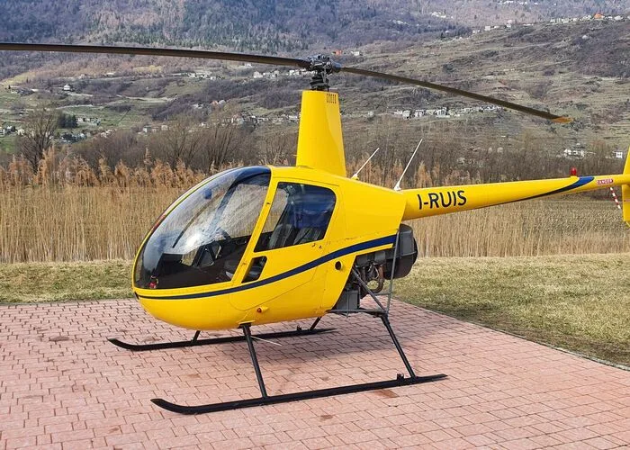 Exterior view of a 2004 Robinson R44 Raven II, I-PNTI.