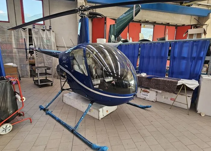 Exterior view of a 2004 Robinson R44 Raven II, I-PNTI.