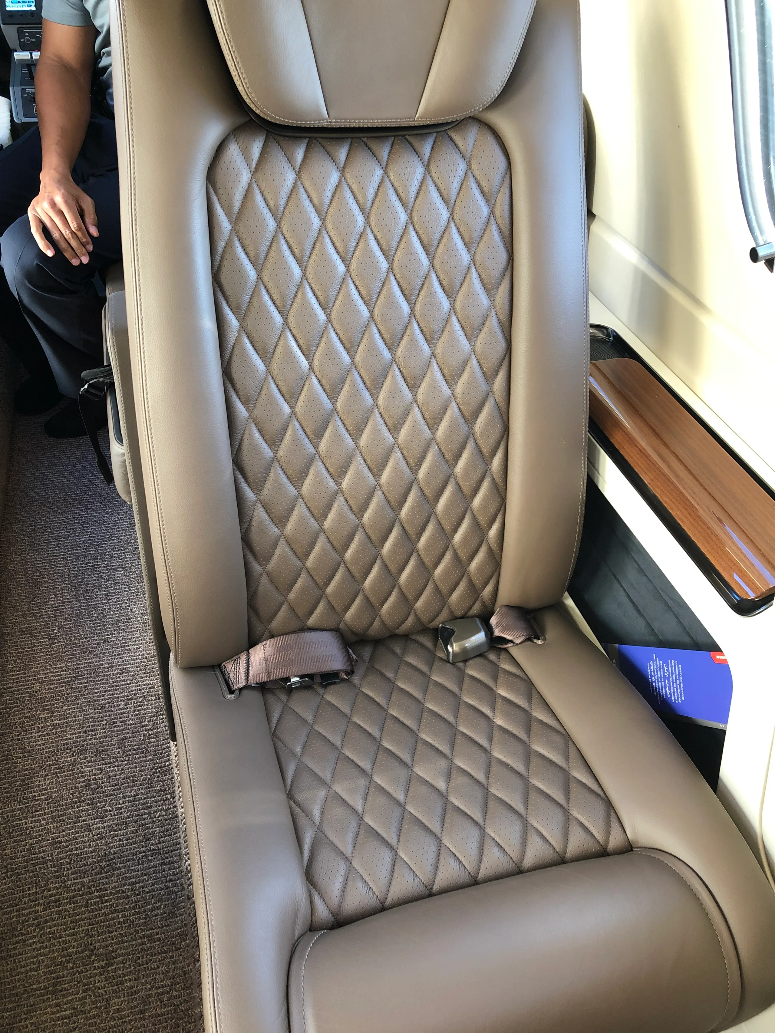 Cabin interior of a 2019 Embraer Phenom 300E.