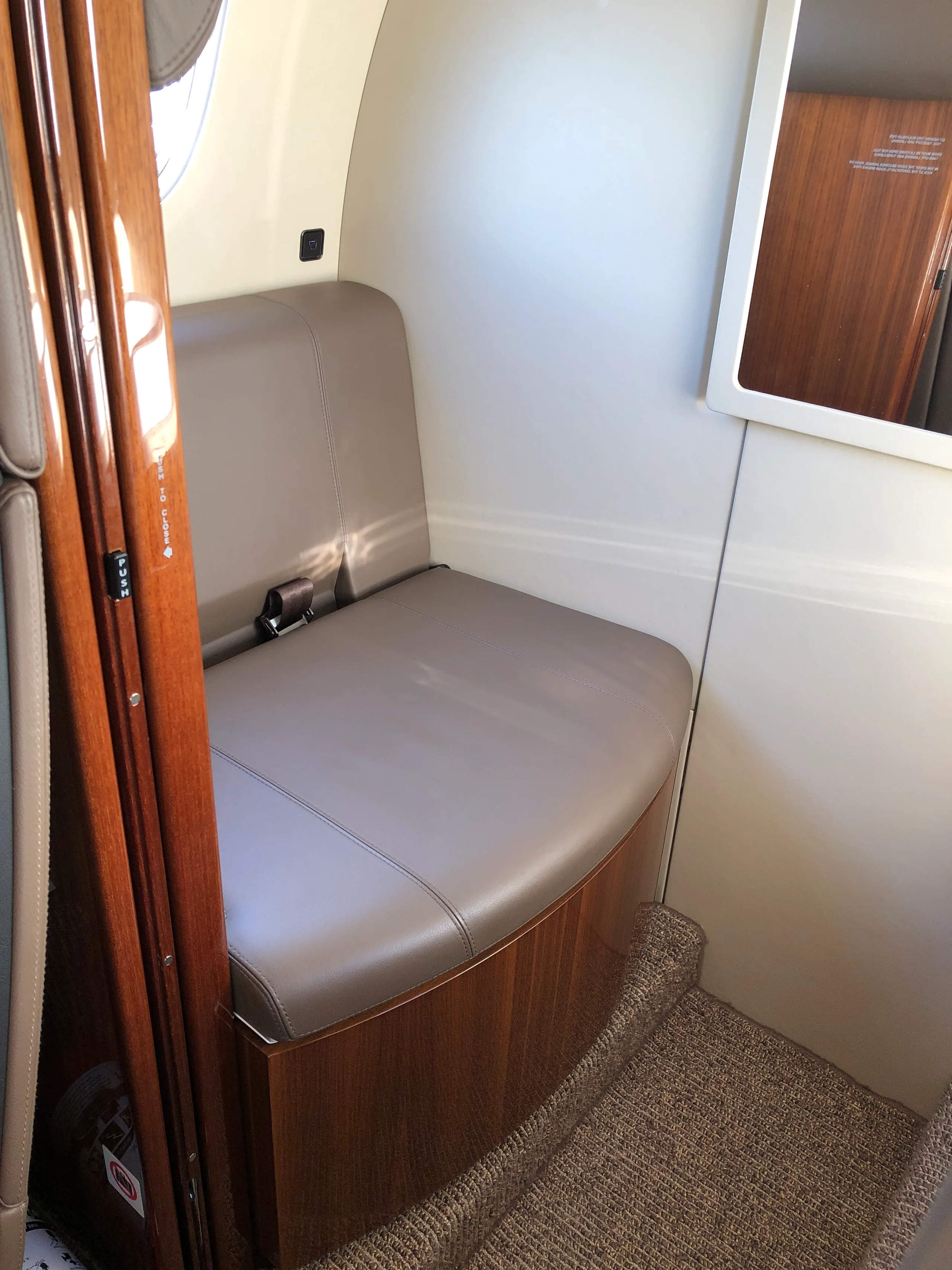 Cabin interior of a 2019 Embraer Phenom 300E.