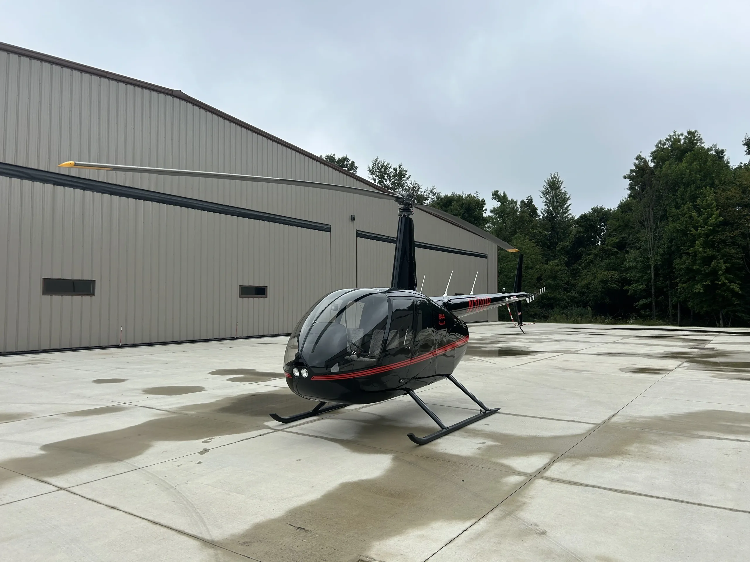 Exterior view of a 2019 Robinson R44 II, N10UP.