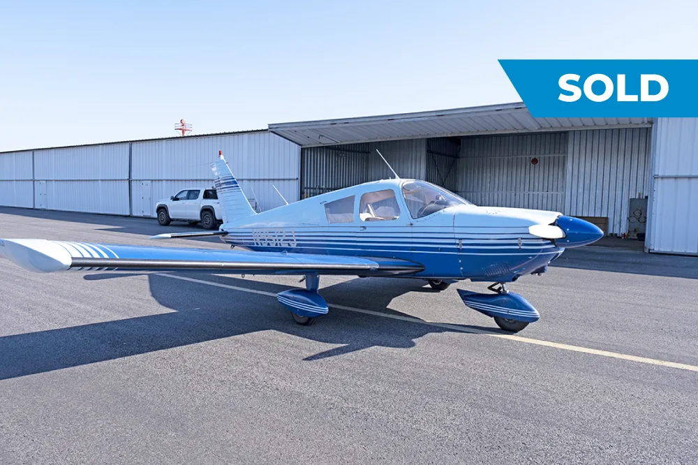 Exterior view of a 1966 Piper Cherokee 180, N9512J.
