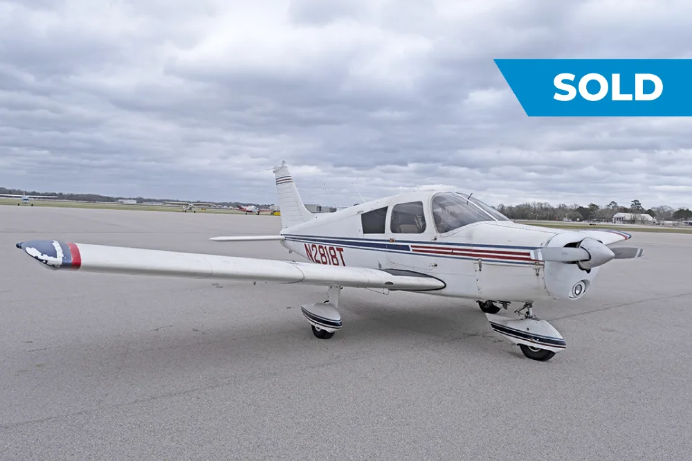Exterior view of a 1972 Piper Cherokee 140, N2818T.