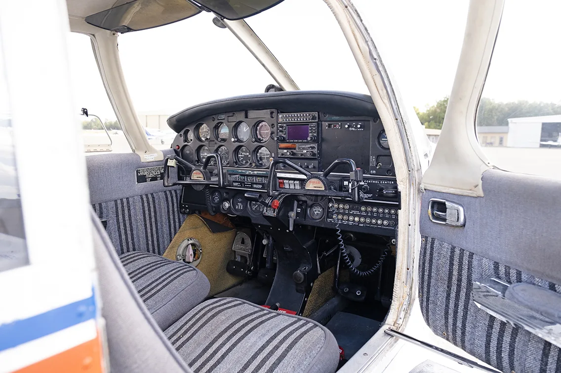 Cockpit and instrument panel of a 1973 Piper PA-28-140.