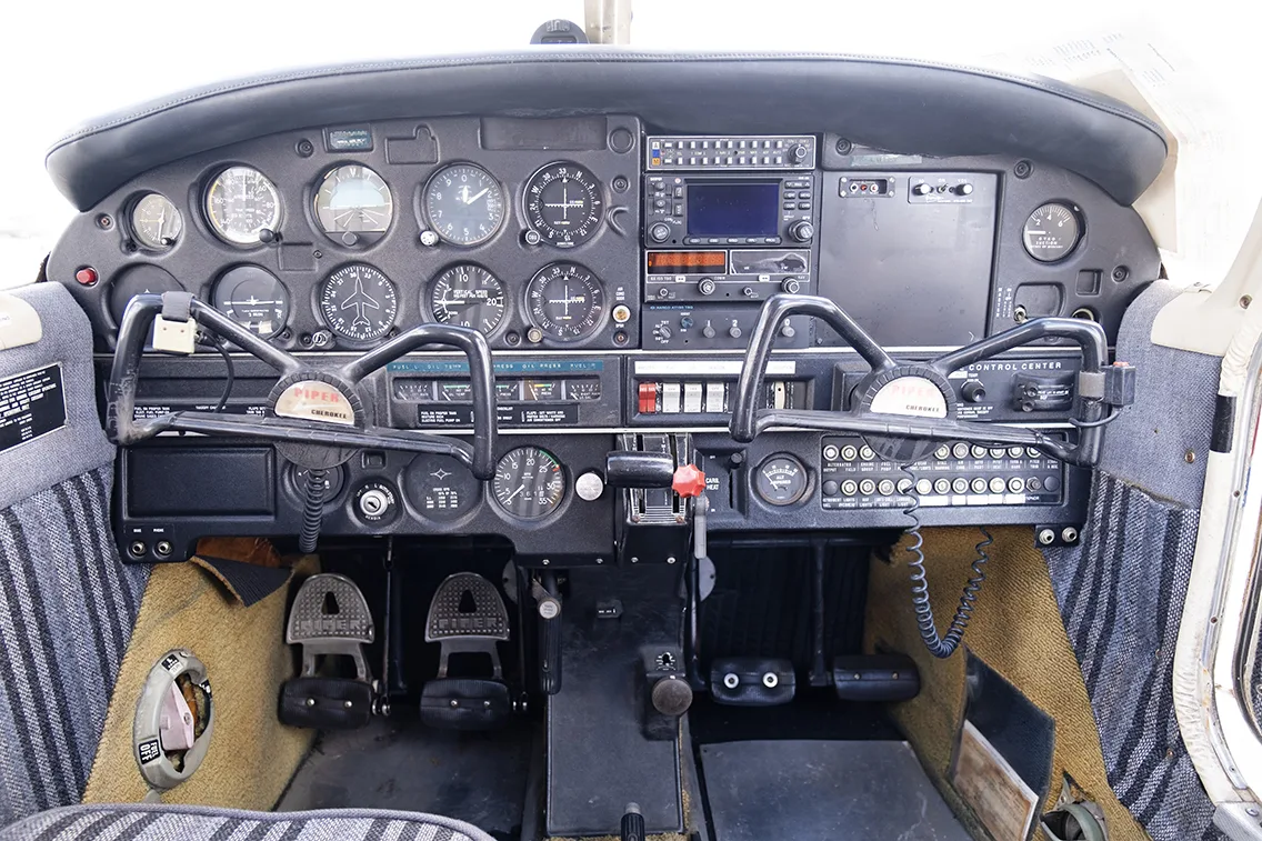 Cockpit and instrument panel of a 1973 Piper PA-28-140.