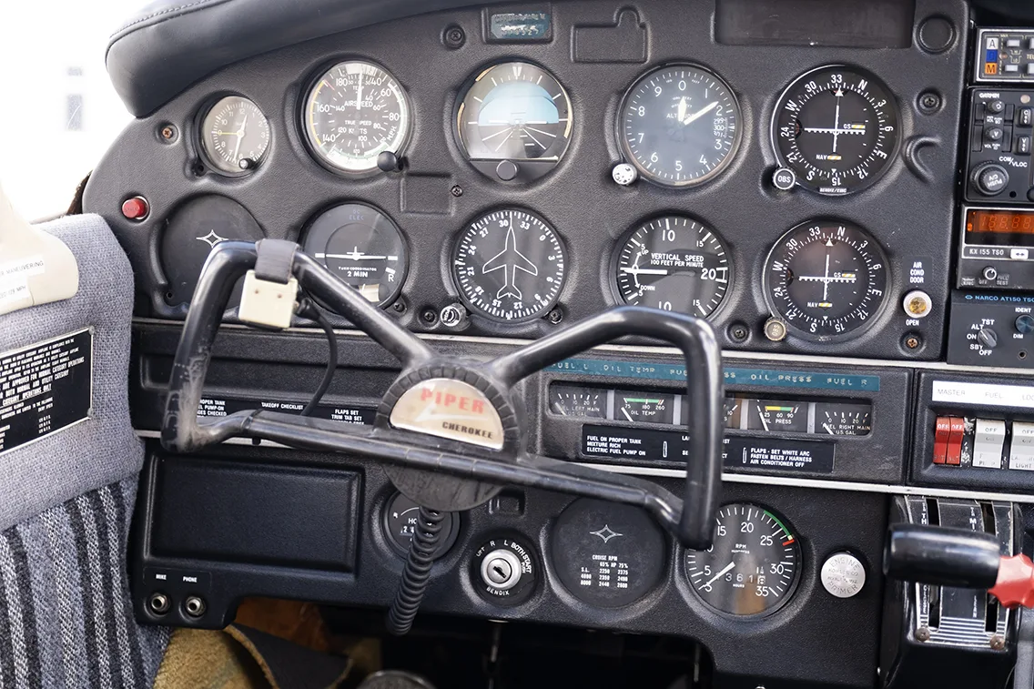Cockpit and instrument panel of a 1973 Piper PA-28-140.