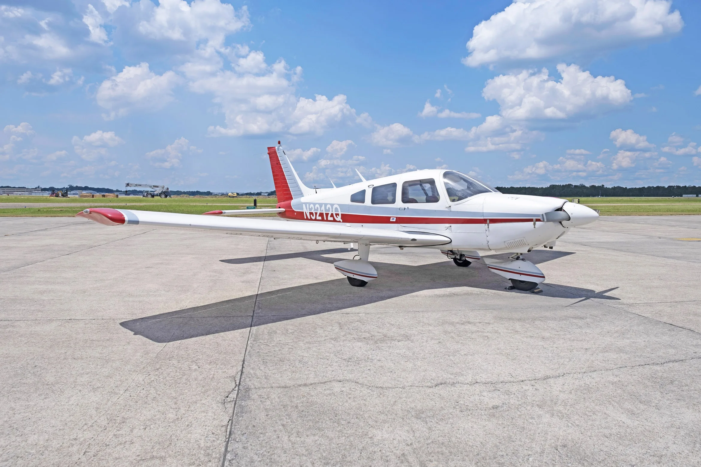Exterior view of a 1977 Piper PA-28-181, N3212Q.