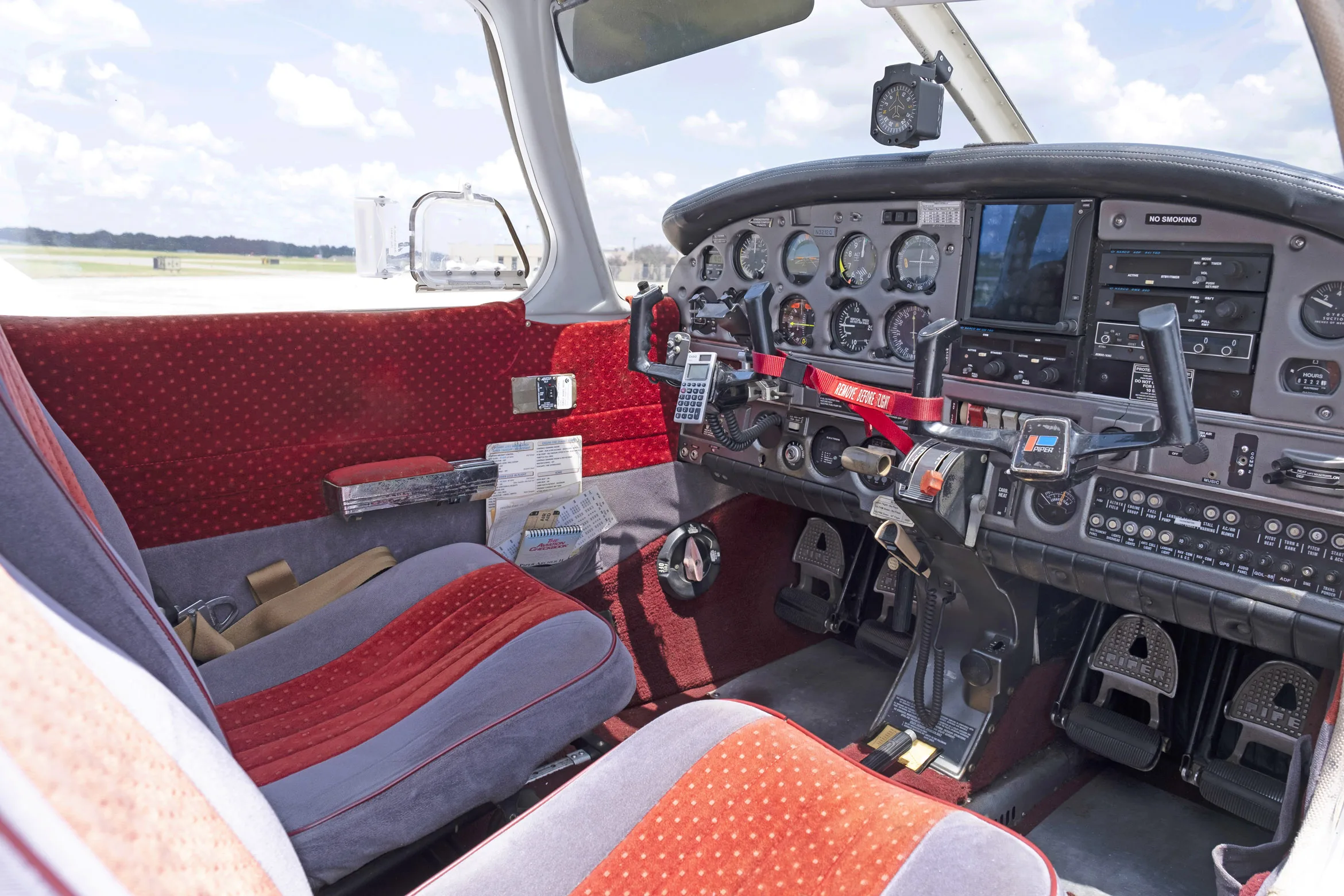 Cockpit and instrument panel of a 1977 Piper PA-28-181.