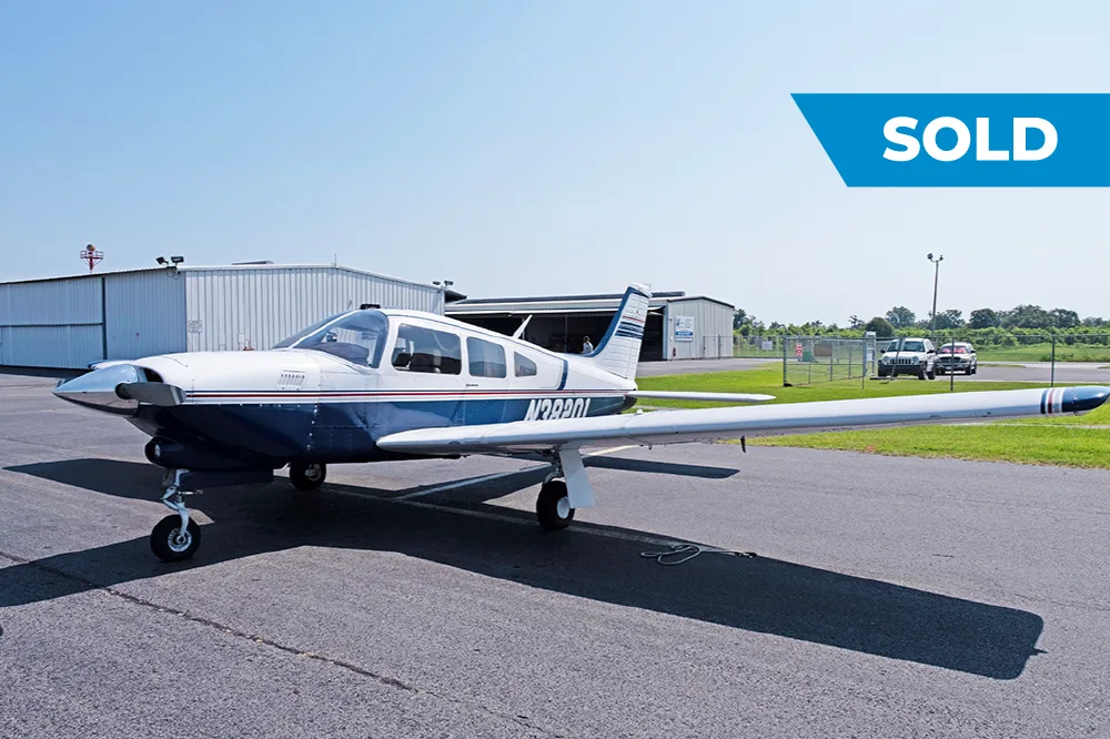 Exterior view of a 1977 Piper Turbo Arrow III, N38201.