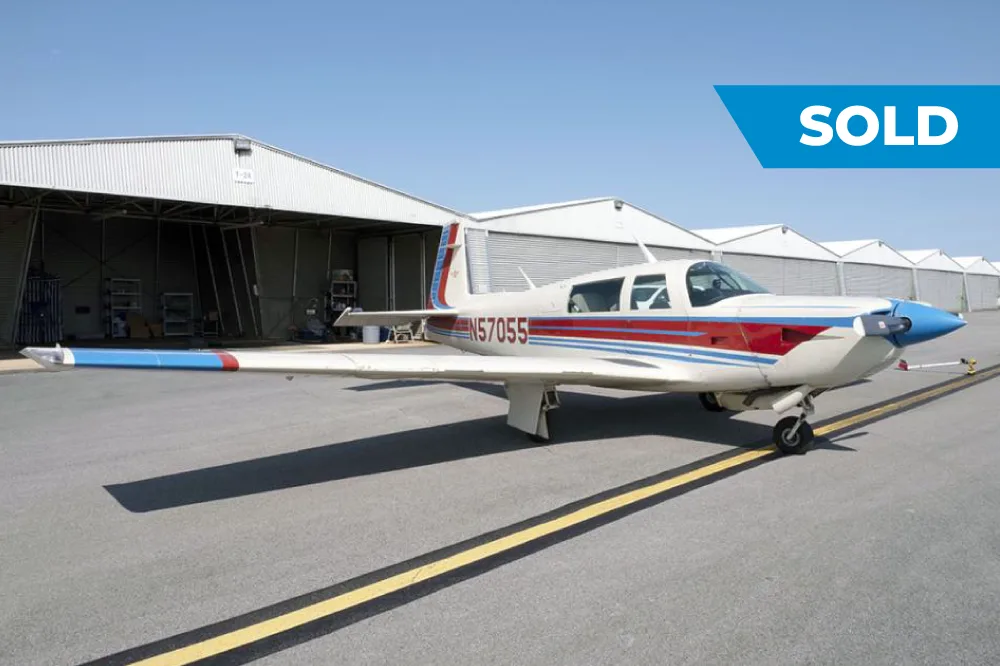 Exterior view of a 1984 Mooney M20K, N57055.