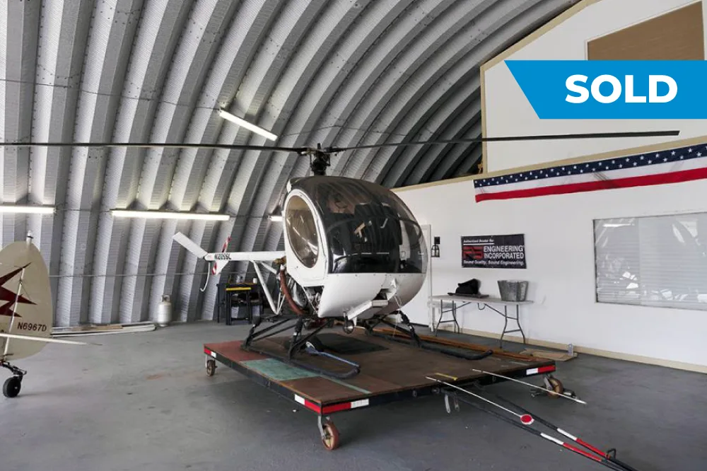 Exterior view of a 1996 Schweizer 269C-1, N205SL.
