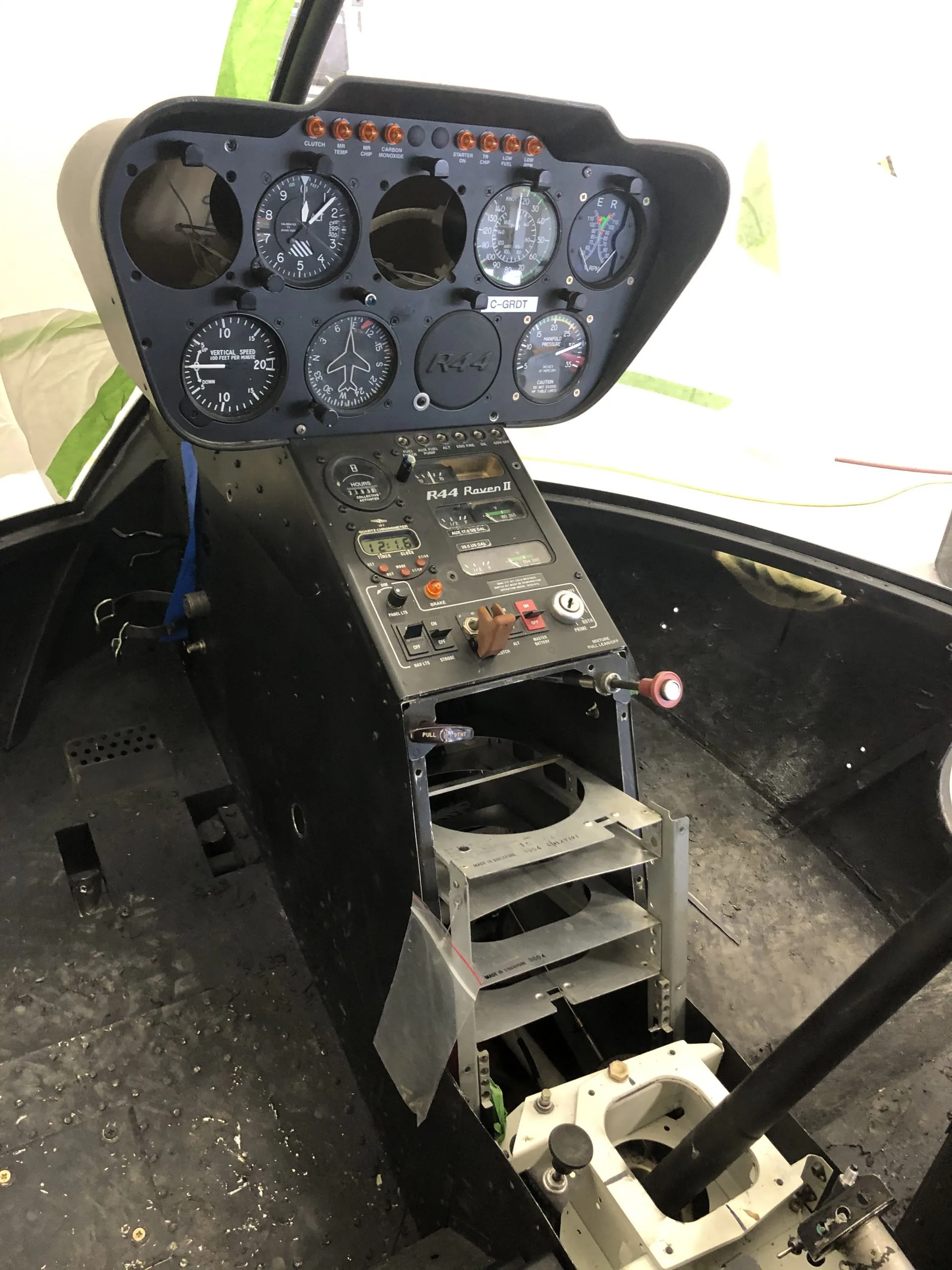 Cockpit and instrument panel of a 2004 Robinson R44 RAVEN II (OH2020).