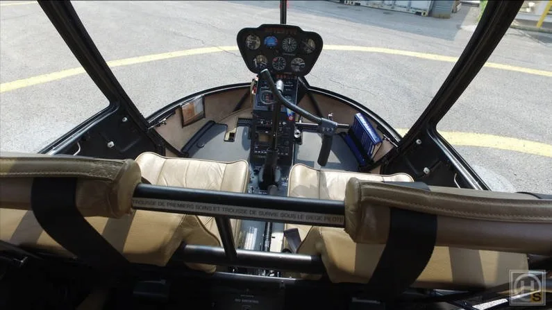Cockpit and instrument panel of a 2009 Robinson R44 CLIPPER II.