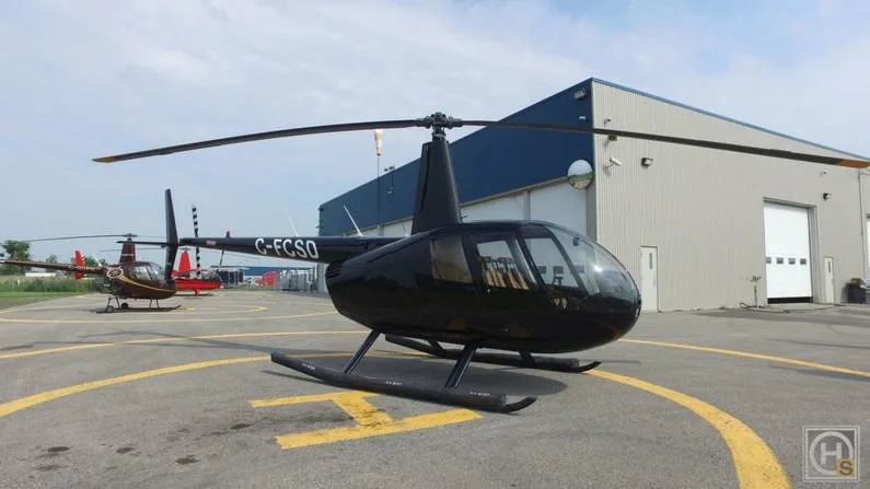 Exterior view of a 2009 Robinson R44 CLIPPER II.