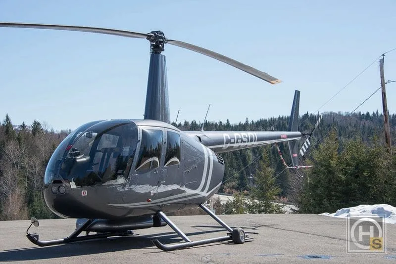 Exterior view of a 2011 Robinson R44 Raven II – 2011, C-GSOL.