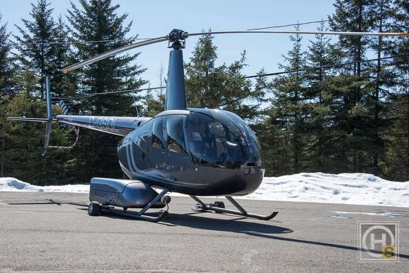 Exterior view of a 2011 Robinson R44 Raven II – 2011, C-GSOL.
