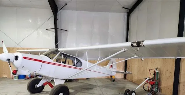 Exterior view of a 1955 Piper PA-18-150, N1662P.