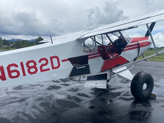 Exterior view of a 1957 Piper PA-18-150, N6182D.