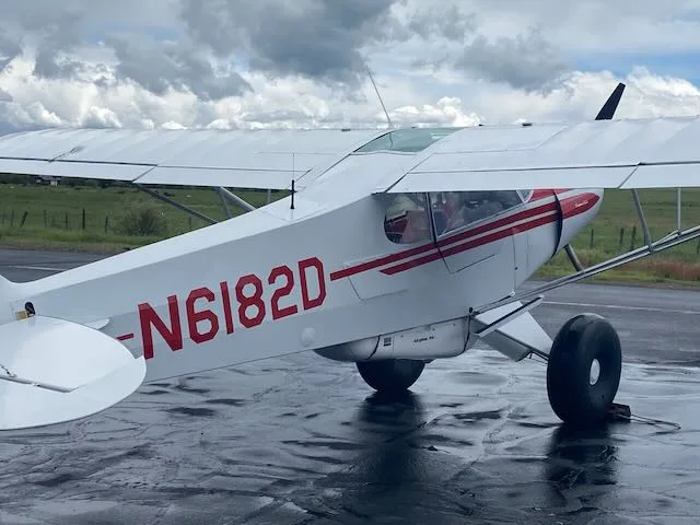 Exterior view of a 1957 Piper PA-18-150, N6182D.