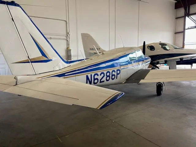 Exterior view of a 1959 Piper Comanche PA24-250, N6286P.