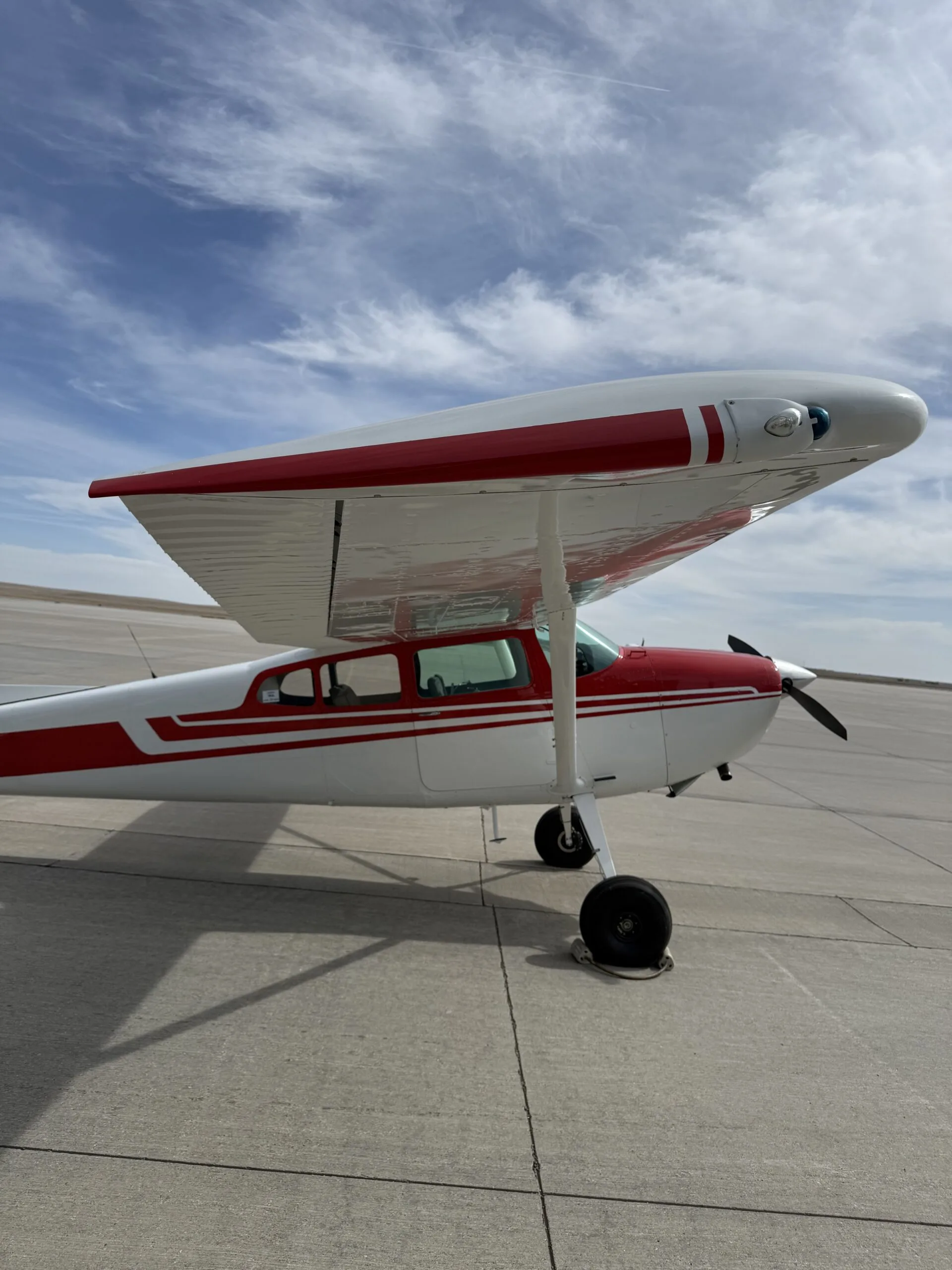 Exterior view of a 1973 Cessna 180J, N42100.