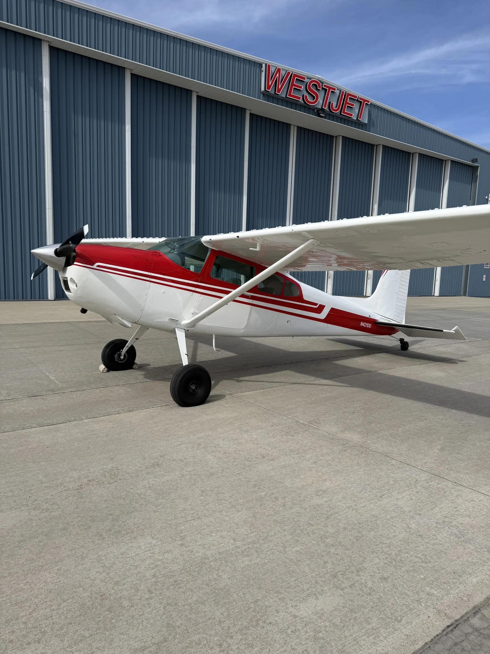 Exterior view of a 1973 Cessna 180J, N42100.